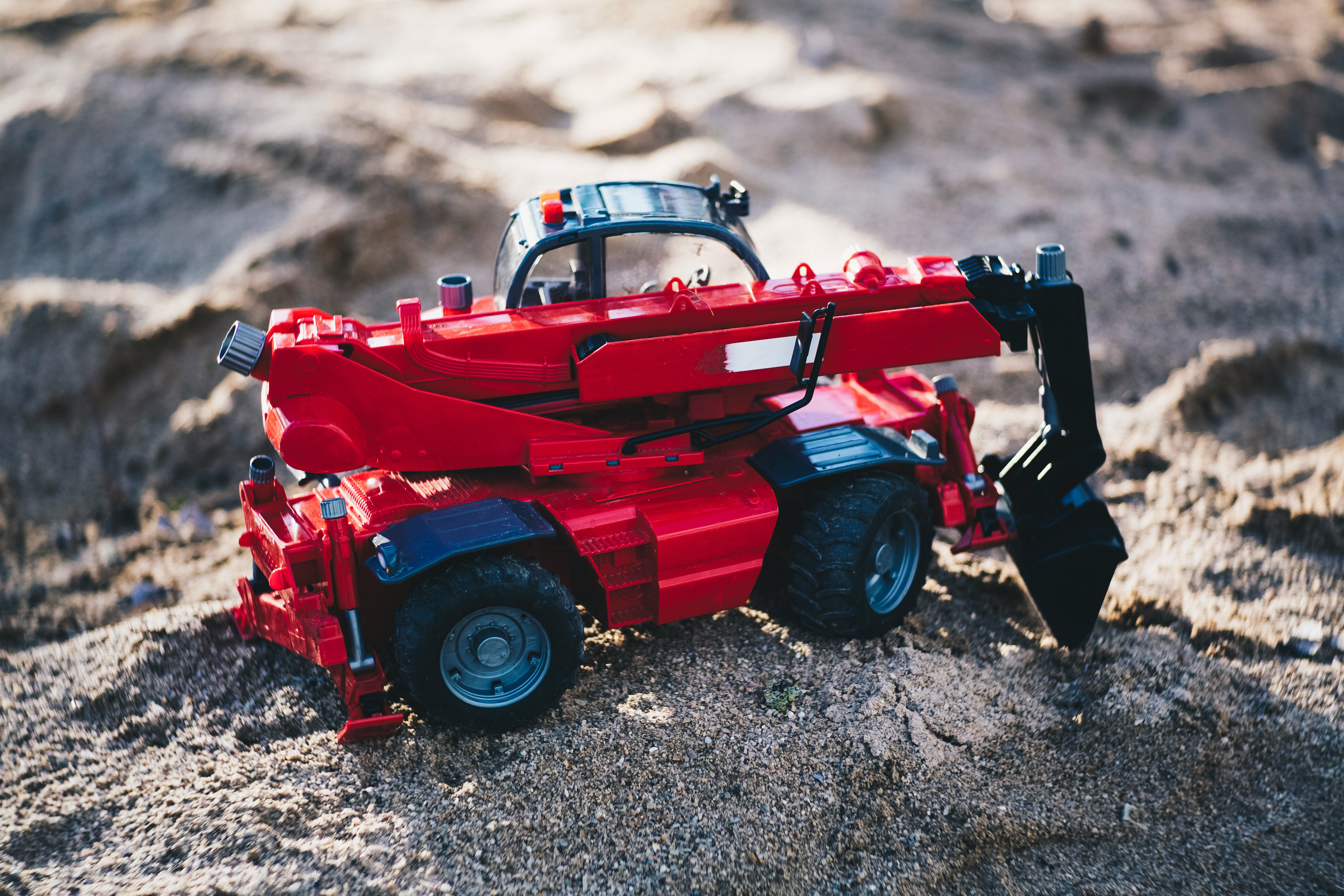 red and black heavy equipment oty